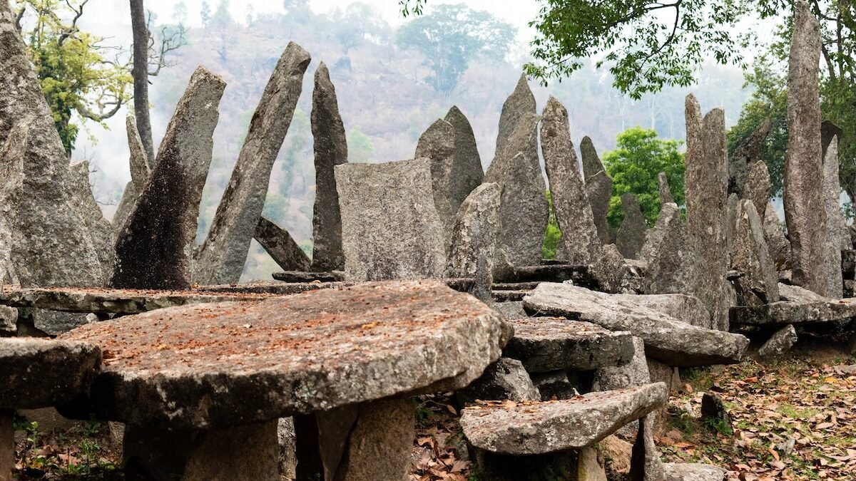 The flat table stones, or Dolmens, rest on smaller stones called Mawkhrum, which symbolize children and grandchildren, representing a family hierarchy.