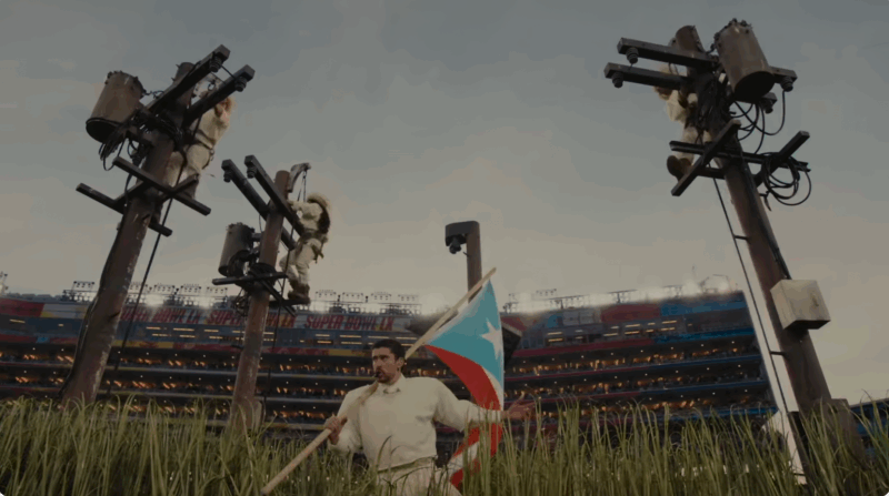 Screenshot of Bad Bunny’s Apple Music Super Bowl Halftime Show showing electricity poles towering above cane fields, taken from the NFL YouTube video. Fair use.